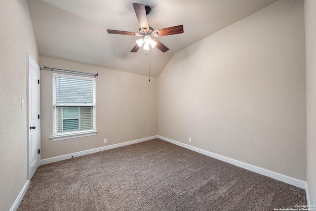 carpeted empty room featuring lofted ceiling and ceiling fan