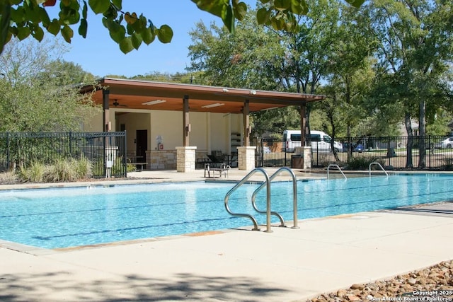 view of pool featuring a patio area and ceiling fan