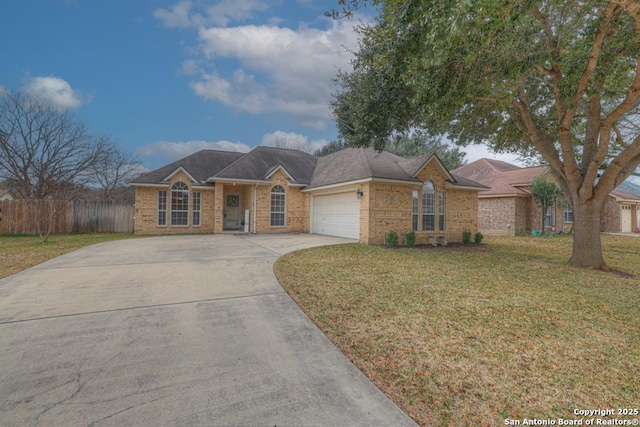 single story home featuring a garage, fence, driveway, and a front lawn