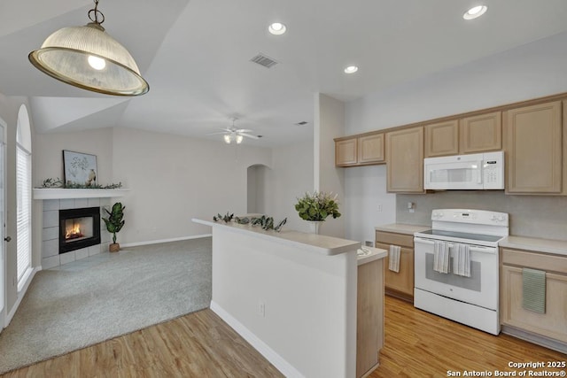 kitchen with light countertops, hanging light fixtures, visible vents, open floor plan, and white appliances