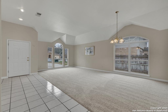 unfurnished living room featuring light tile patterned floors, lofted ceiling, light carpet, visible vents, and an inviting chandelier