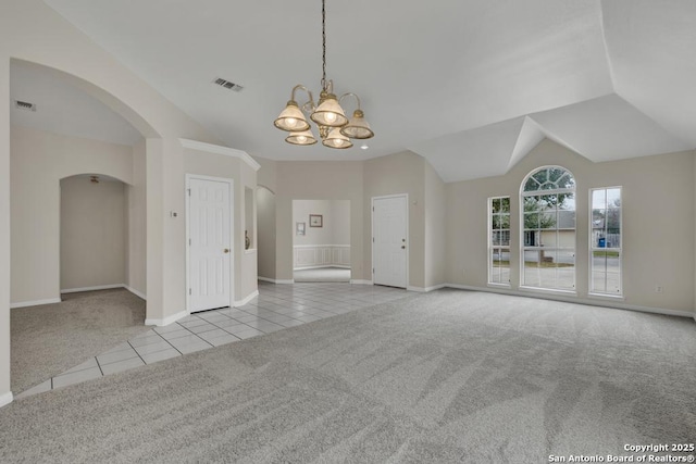 unfurnished living room featuring light tile patterned flooring, a notable chandelier, light carpet, visible vents, and vaulted ceiling