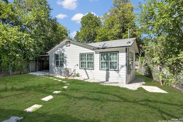 view of side of home with a lawn