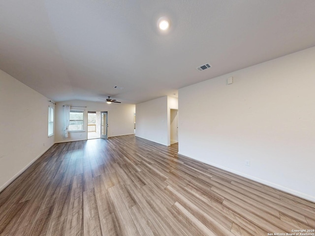 unfurnished living room with ceiling fan and light hardwood / wood-style flooring