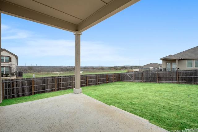 view of yard featuring a patio and a fenced backyard