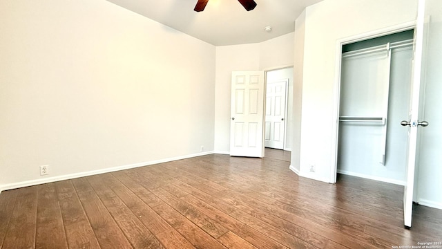 unfurnished bedroom featuring ceiling fan, dark hardwood / wood-style floors, and a closet