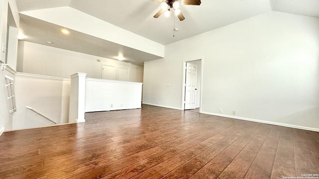 unfurnished room with ceiling fan, dark hardwood / wood-style flooring, and vaulted ceiling