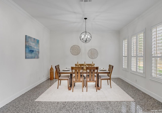 dining space featuring crown molding and a chandelier