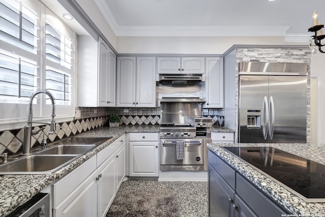 kitchen featuring appliances with stainless steel finishes, tasteful backsplash, sink, gray cabinetry, and crown molding