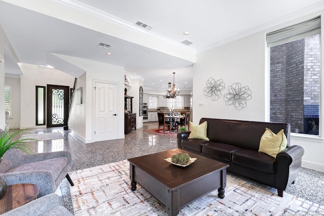 living room featuring ornamental molding and a chandelier