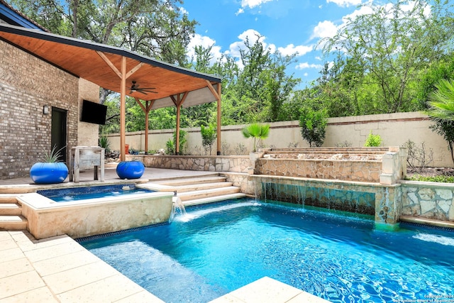 view of pool with pool water feature, ceiling fan, and a jacuzzi