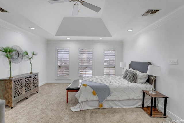 carpeted bedroom featuring a raised ceiling, ornamental molding, and multiple windows