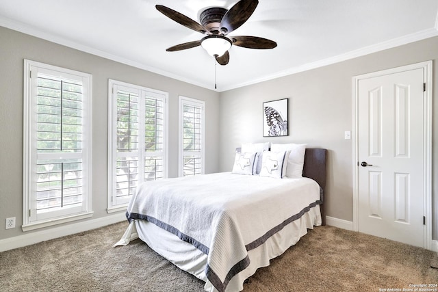 carpeted bedroom with crown molding and ceiling fan