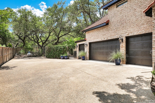 view of property exterior with a garage