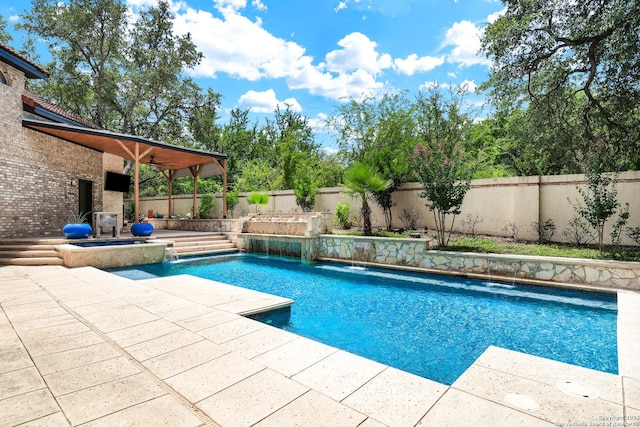 view of pool featuring pool water feature and a patio