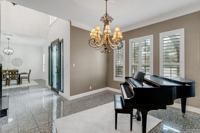 misc room featuring ornamental molding and an inviting chandelier