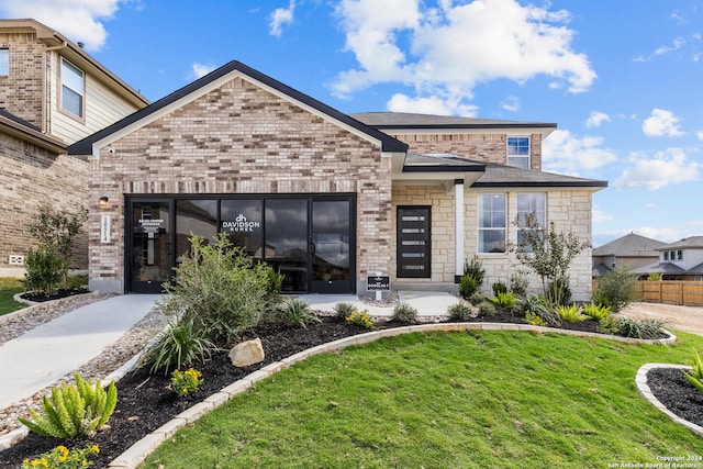 view of front of property with a front lawn