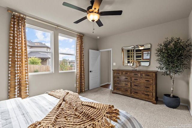 carpeted bedroom featuring ceiling fan