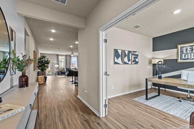 office space with hardwood / wood-style flooring and ceiling fan