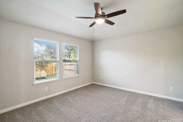 spare room featuring carpet floors and ceiling fan