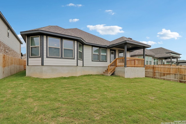 rear view of property with roof with shingles