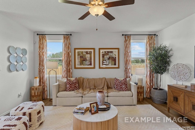 6879 Comanche Cave, San Antonio, TX 78247 - living room featuring plenty of natural light, ceiling fan, and light hardwood / wood-style flooring