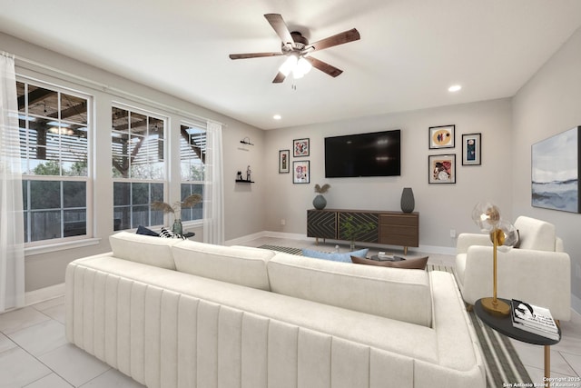 living room featuring ceiling fan and light tile patterned flooring