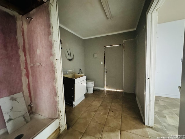 bathroom with crown molding, vanity, and a shower