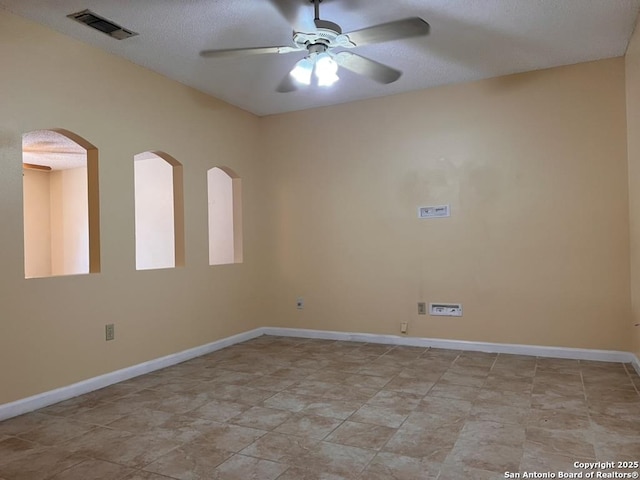 empty room featuring ceiling fan