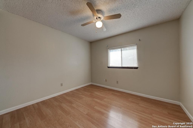 unfurnished room with ceiling fan, a textured ceiling, and light hardwood / wood-style floors