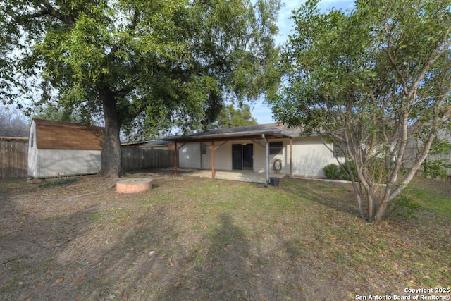 back of property featuring a patio area