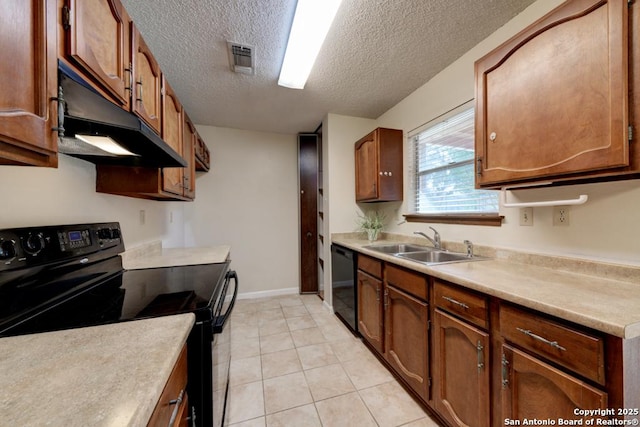 kitchen featuring sink, black appliances, a textured ceiling, and light tile patterned floors