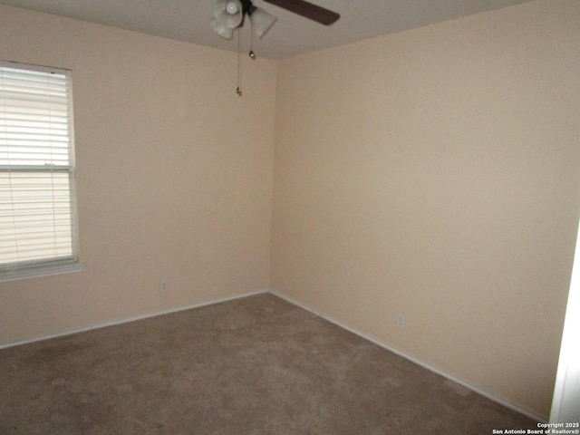 empty room featuring ceiling fan and carpet flooring