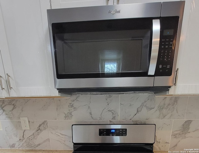 39 Post Oak Ln, Vernia, TX 78121 - room details with white cabinets and backsplash