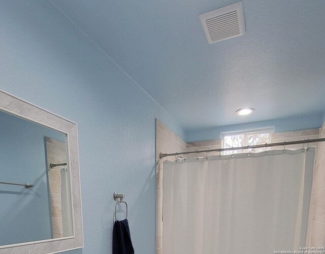 39 Post Oak Ln, Vernia, TX 78121 - bathroom with a textured ceiling and walk in shower