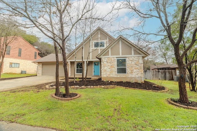 english style home with cooling unit, a garage, and a front lawn