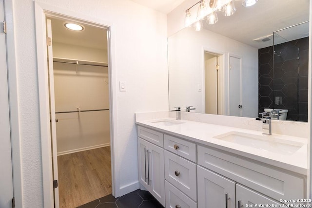 bathroom featuring vanity and tile patterned flooring