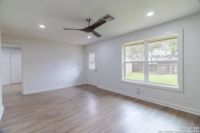 unfurnished room featuring ceiling fan and wood-type flooring