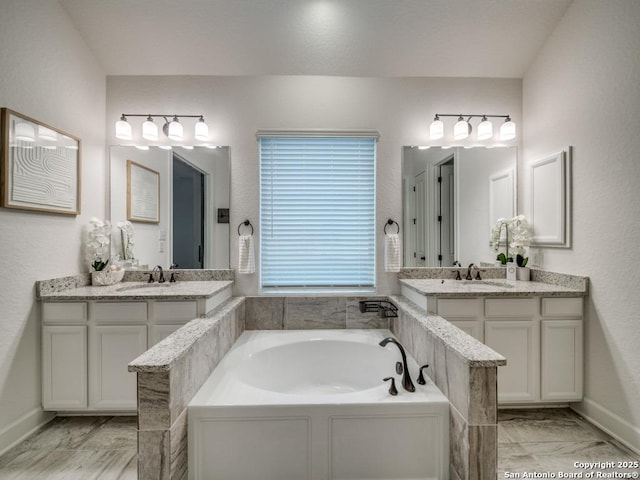 bathroom with vanity and a bathtub