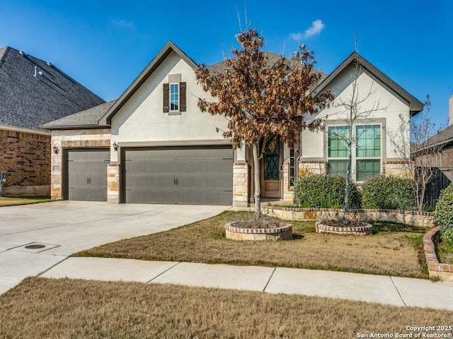 view of front of house with a garage and a front yard