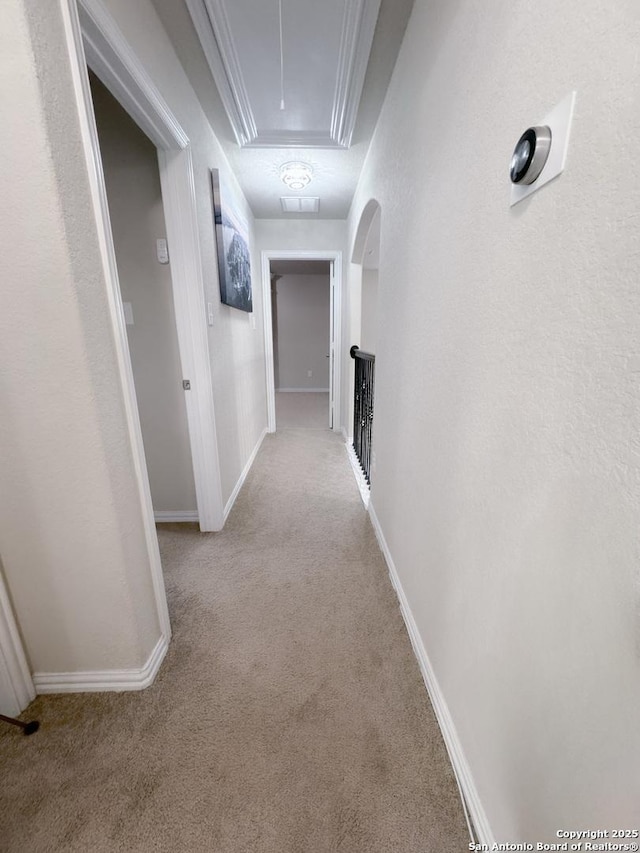 corridor featuring light colored carpet