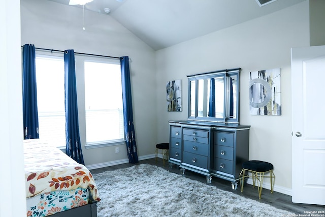 bedroom featuring dark hardwood / wood-style flooring and vaulted ceiling