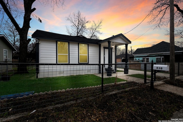 view of front of house with a fenced front yard and a front yard