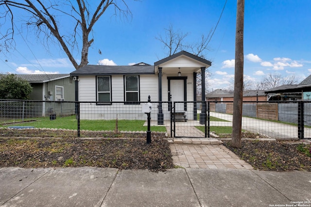 view of front of house featuring a fenced front yard and a gate