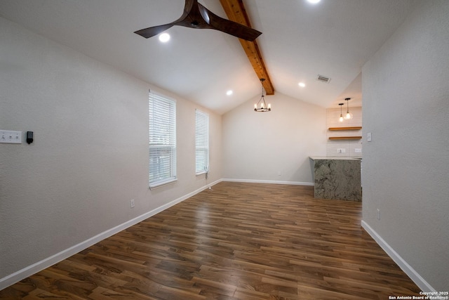 unfurnished living room with vaulted ceiling with beams, dark wood finished floors, visible vents, a ceiling fan, and baseboards