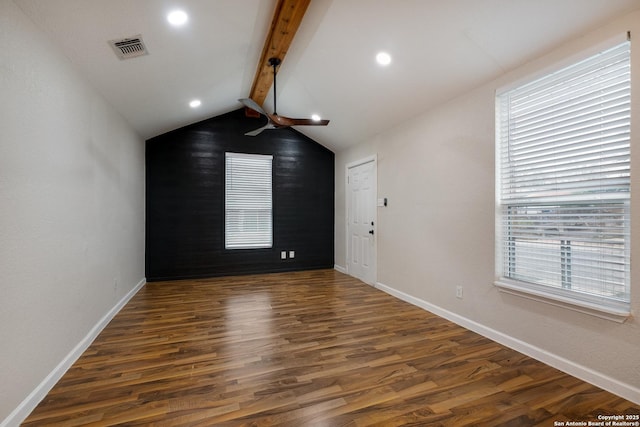 unfurnished room featuring vaulted ceiling with beams, dark wood finished floors, recessed lighting, visible vents, and baseboards