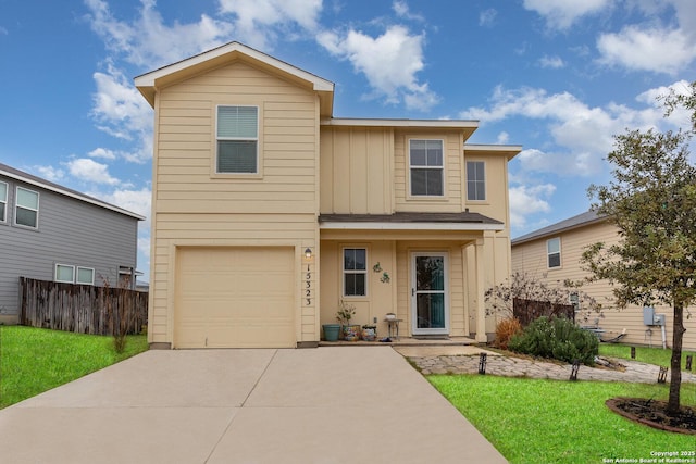 front facade with a garage and a front yard