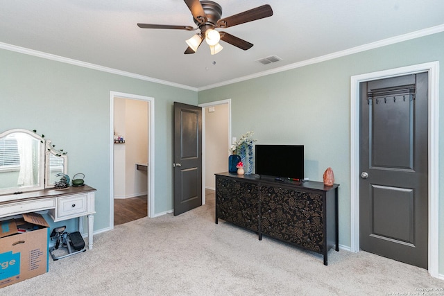 carpeted bedroom with crown molding and ceiling fan