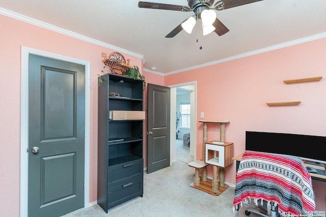 carpeted bedroom with ornamental molding and ceiling fan