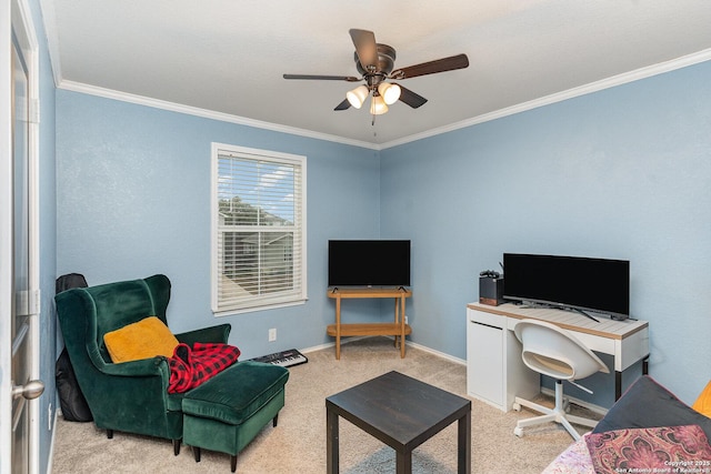 carpeted home office featuring crown molding and ceiling fan